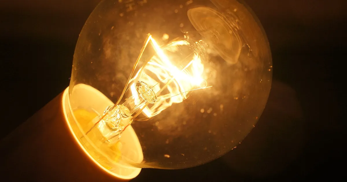 Glowing incandescent lamp with a coiled filament, the classic use of doped tungsten wire